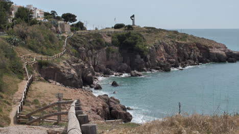 Path-along-the-mediterranean-sea-rocky-cliffs-touristic-shore-walk-France-Sete